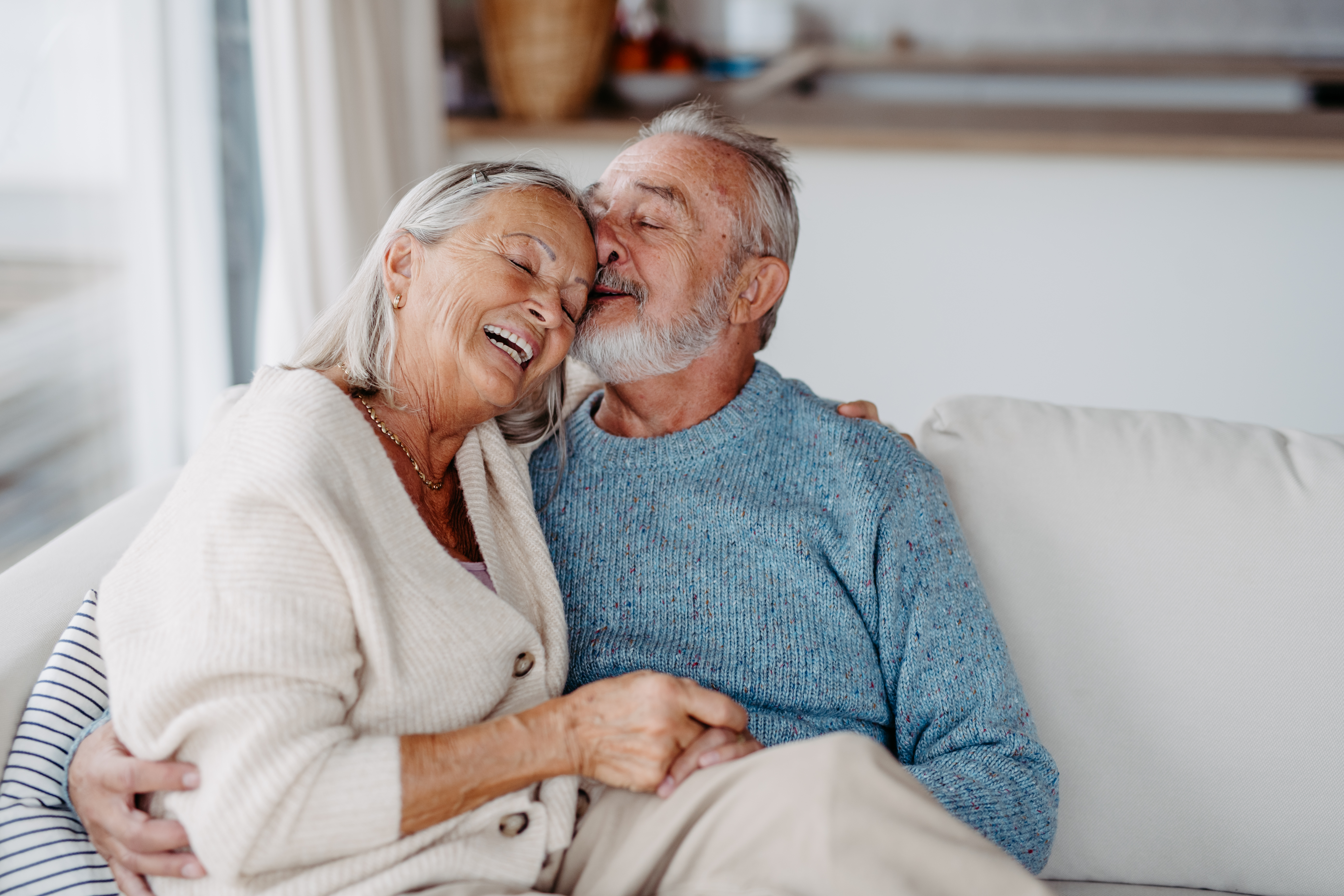 Happy couple sitting on couch