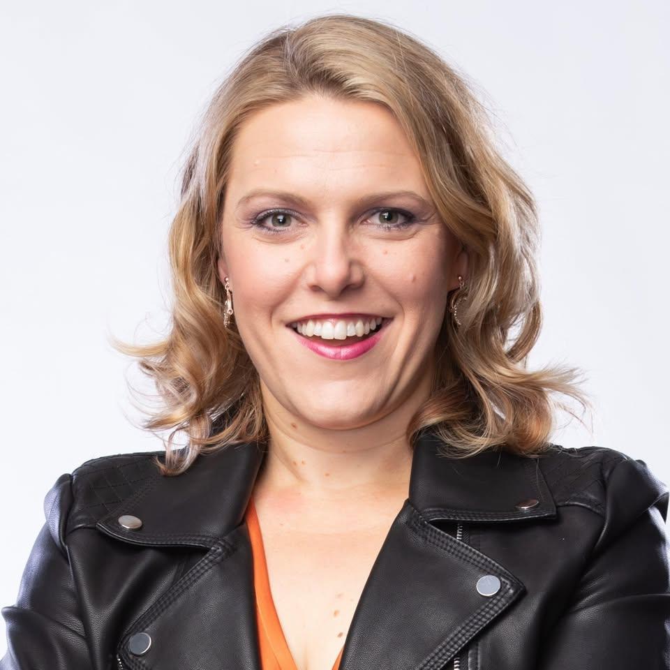 Woman in black leather jacket smiling