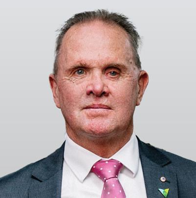 Man in jacket and pink tie