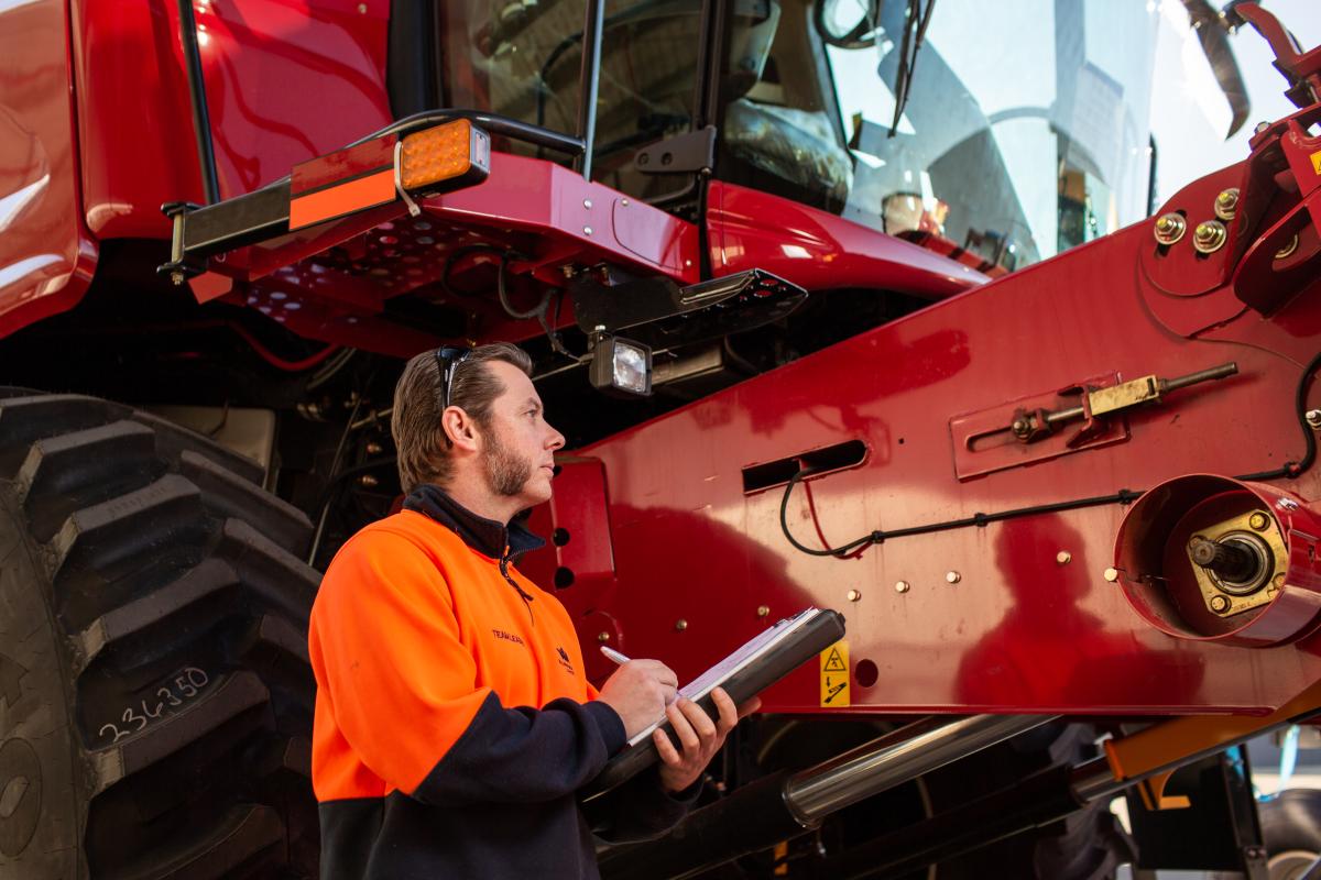 Image of Matt in high vis gear inspecting a heavy vehicle