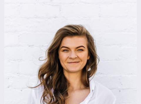 Long haired woman in a white shirt
