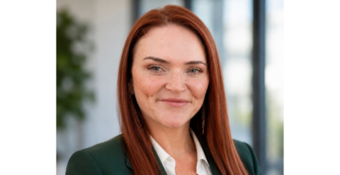 Woman with red hair smiling