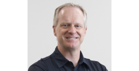 Smiling man in black shirt