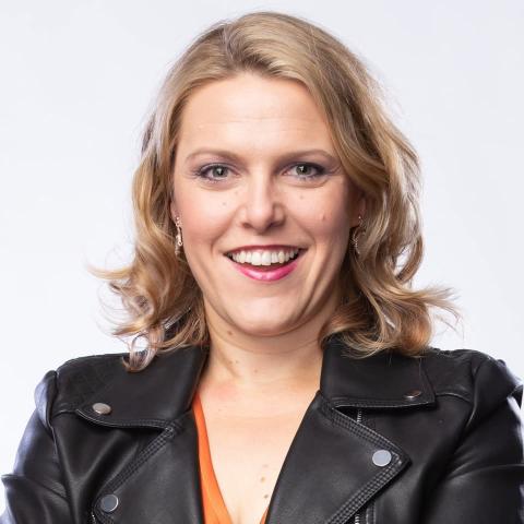 Woman in black leather jacket smiling